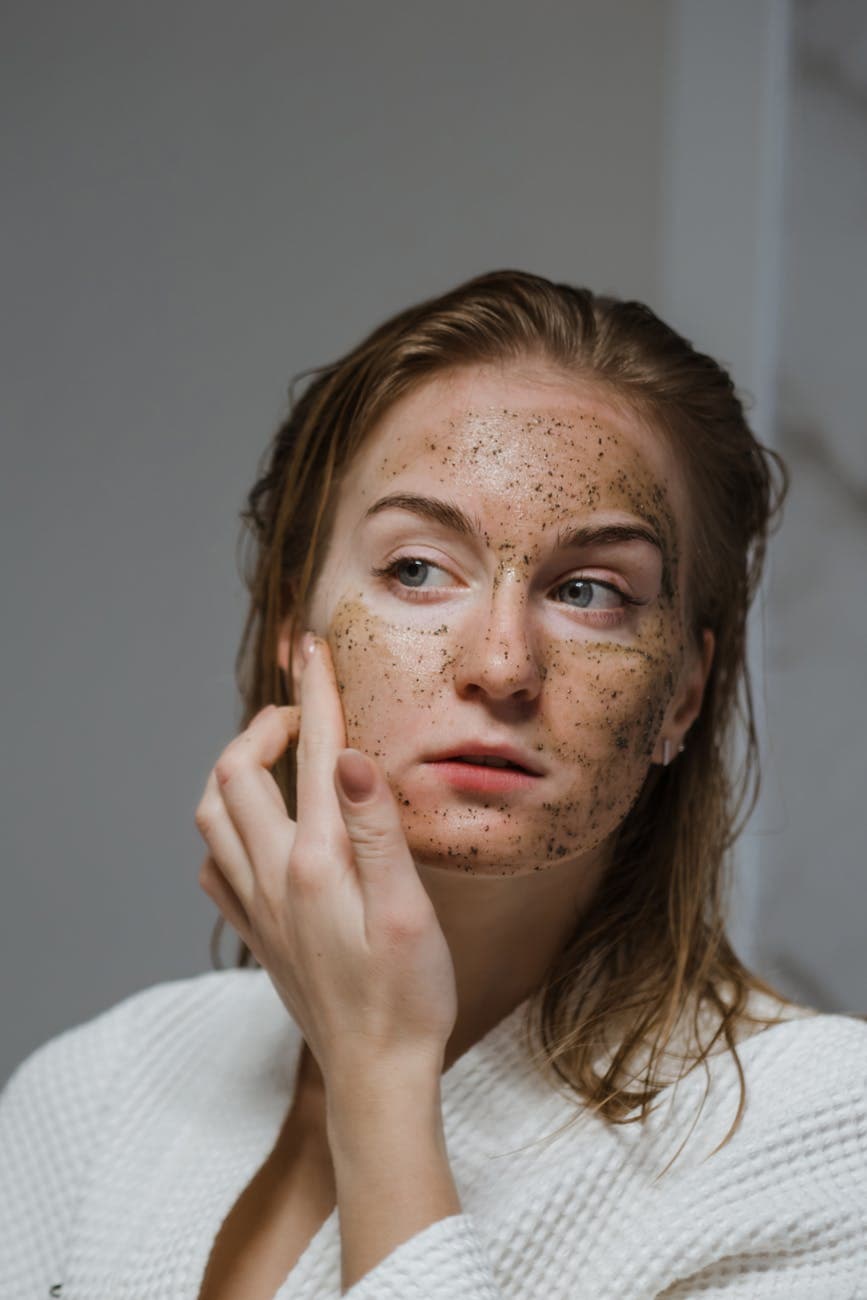 Woman with natural face scrub representing clean beauty