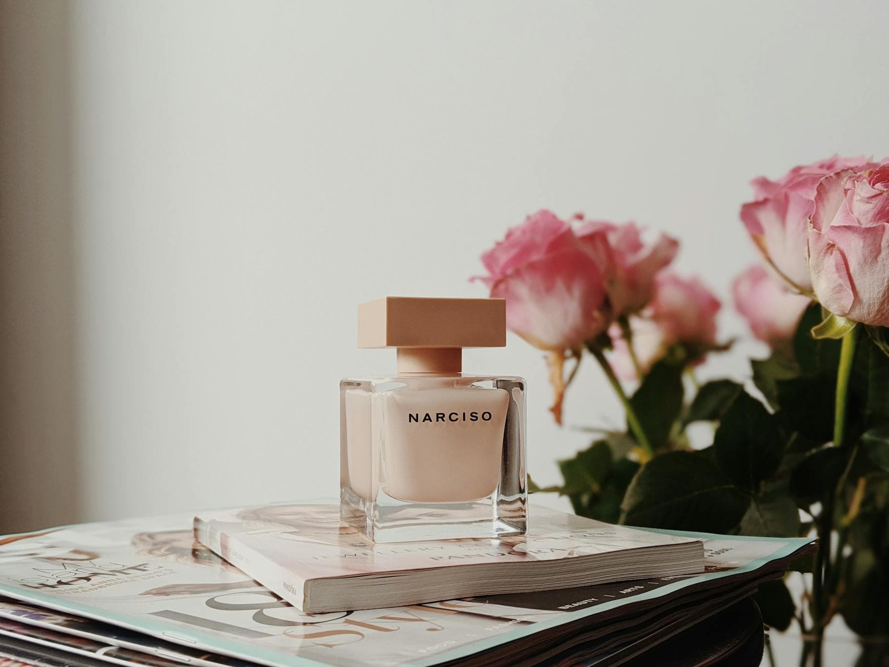 Narciso fragrance bottle with pink flowers